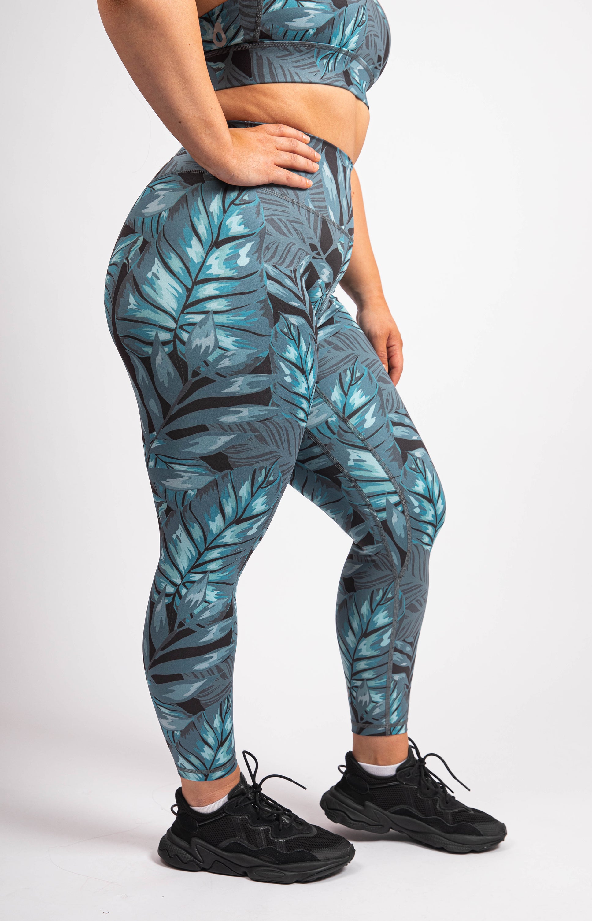 Palm leaf printed athletic leggings. Inseam approximately 28 in length. •  Flat reinforced high rise waistband • Hidden waistband pocket for keys,  phone, cash • Palm leaf print • Flat stitched seams